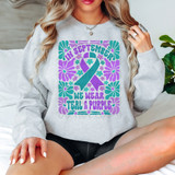 In September We Wear Teal & Purple Floral DTF Heat Transfer, colorful teal and purple floral design with teal and purple ribbon and text on a gray sweatshirt.