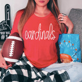 Cardsinals Mascot WHITE DTF Heat Transfer, a white heat transfer design with the word 'cardinals' in cursive script laid on a red t-shirt.