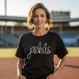 Jackets Mascot WHITE DTF Heat Transfer, a woman wearing a black t-shirt with 'jackets' printed in white on the front, on a sports field.