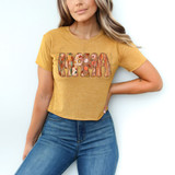 Mama Fall Pattern DTF Heat Transfer, colorful floral and pattern design on a yellow T-shirt worn by a woman.