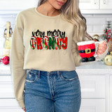 Very Merry Granny DTF Heat Transfer, Christmas-themed festive design on a beige sweatshirt with holiday colors and patterns.