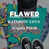 Flawed Rainbow Love Sequin Patch, colorful rainbow design with sequins on turquoise fabric surrounded by jeans, sneakers, and colorful beads.