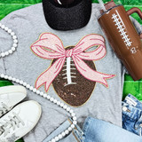 Sequin Football with Pink Sequin Bow Patch, fashion clothing embellishment on grey T-shirt, colorful accessories and casual outfit.
