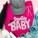 Santa Baby With Hat Sequin Patch, a festive pink sweatshirt with sparkling sequin embroidery of the words 'Santa Baby' and a Santa hat on the letters, paired with a gray hat with black dots, striped candy canes, white sneakers, denim shorts, and turquoise bead necklaces, perfect for Christmas celebration.
