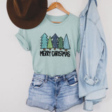 Merry Christmas Hand Painted Trees DTF Heat Transfer, image showing a light blue T-shirt with a colorful pine trees design and the text 'Merry Christmas' printed on it.