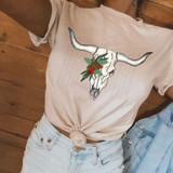 Product Christmas Bull Skull DTF Heat Transfer, festive bull skull with Christmas holly and pine cones design on a white t-shirt.