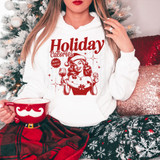 Holiday Calories Don't Count DTF Heat Transfer, Christmas-themed hoodie with a festive illustration of a woman holding a glass of wine and a cookie, in front of a decorated Christmas tree.