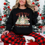 North Pole Christmas Tree Farm DTF Heat Transfer, woman in Christmas pajamas with Christmas trees and ornaments in the background.