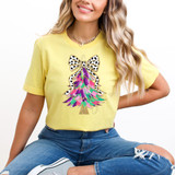 Pink/Green/Purple Brushstroke Christmas Tree Faux Glitter DTF Heat Transfer, colorful Christmas tree design with brushstroke pattern and glitter accents on a yellow T-shirt.