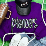 Pioneers Sequin Patch, a colorful sparkling patch with the word 'pioneers' embroidered in glittering sequins on a purple sweatshirt.