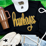 Hawkeyes Gold Sequin Patch, gold sequined patch spelling hawkeyes on a black shirt, with accessories and other items around it.