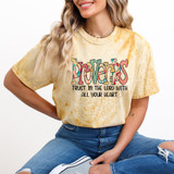 Proverbs 3: 5-6 DTF Heat Transfer, colorful and inspiring Bible verse design on a yellow tie-dye T-shirt worn by a woman.