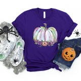 Pastel pumpkin ADULT Screen Print Heat Transfer, colorful pastel pumpkin graphic on a purple T-shirt, Halloween themed casual apparel.
