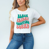 Black Friday Shopping Squad DTF Heat Transfer, colorful graphic design on a white T-shirt showcasing the text 'Black Friday Shopping Squad' in playful font.