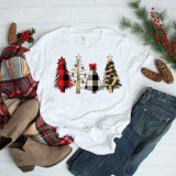 Christmas Tree Patterned Sublimation Transfer, festive Christmas-themed happy holiday design on a white T-shirt with various Christmas trees decorated with plaid, glitter, and animal print patterns.