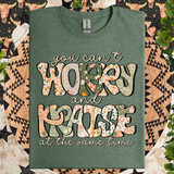 You Can't Worry And Praise At The Same Time DTF Heat Transfer, green T-shirt with a motivational quote design in colorful floral and patterned text.