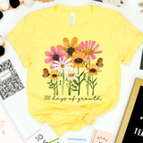 100 Days Of Growth DTF Heat Transfer, yellow T-shirt with floral and butterfly design and the text '100 days of growth'.