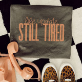 Life Update Still Tired, DTF Heat Transfer, colorful print on fabric, with peach rotary phone and leopard print sneakers, on black and white checkered background.