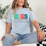Grams She Is Clothed In Gratitude Counting Blessings Every Day DTF Heat Transfer, a colorful and decorative graphic design on a light blue t-shirt.