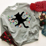 Fried Pussycat Christmas Vacation Screen Print Heat Transfer, black cat silhouette wrapped in colorful holiday string lights on a gray sweatshirt.