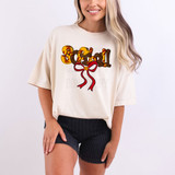 Softball Coquette DTF Heat Transfer, colorful softball-themed graphic design on a beige t-shirt worn by a smiling woman.