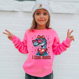 I Steal Hearts Dinosaur DTF Heat Transfer, a colorful heat transfer design featuring a cartoon dinosaur holding a heart, with the text "I Steal Hearts" on a pink background worn by a young girl.