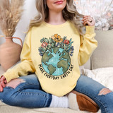 Make Every Day Earth Day DTF Heat Transfer, a woman wearing a yellow sweatshirt with a colorful earth-themed floral design and the phrase 'Make Every Day Earth Day' on it.