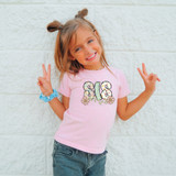 Sis Easter Pattern DTF Heat Transfer, colorful Easter-themed design on a pink children's t-shirt.