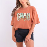 Gram Easter Pattern DTF Heat Transfer, colorful floral and Easter-themed graphic design on a casual women's t-shirt.