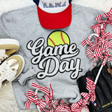 Softball White Game Day Sequin Patch, embroidered patch with a yellow softball and the words 'Game Day' in black and white, on a casual gray sweatshirt surrounded by sneakers, baseball cap, and striped ribbons.