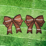Football Bow Sides Glitter Patch SET OF 2, glittery football-themed bow patches with black outline and white line details, designed for decorative or wearable craft projects.