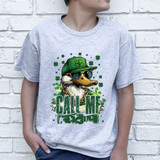 Call Me Duck Call DTF Heat Transfer, graphic of a duck wearing sunglasses and a green cap with a shamrock, surrounded by shamrocks and the words 'Call Me' in green letters.