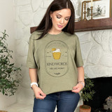 Sweet To The Soul DTF Heat Transfer, woman wearing a beige T-shirt with honey jar and honey dipper graphic and inspirational quote.