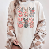Floral Bunny DTF Heat Transfer, colorful bunny designs with floral patterns on a white T-shirt.