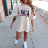 LW Collage DTF Heat Transfer, a woman wearing a white oversized t-shirt with a colorful graphic design and text.