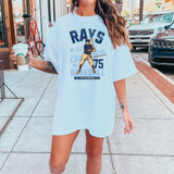 Vintage Rays Baseball DTF Heat Transfer, vintage baseball player graphic design on a white oversized T-shirt worn by a woman outdoors.