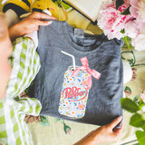 DrP Floral Coquette Can DTF Heat Transfer, colorful floral pattern on a soda can design applied to a gray T-shirt.