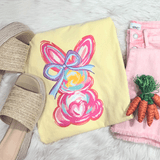 Pink Bunny CLEAR Screen Print Heat Transfer, colorful bunny design with a bow on a yellow fabric.