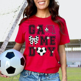 Game Day Soccer DTF Heat Transfer, vibrant pink T-shirt with soccer-themed graphic design including a goal, football, bow, and floral accents.
