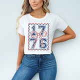 1776 Coquette Bow DTF Heat Transfer, a fashionable white T-shirt with a patriotic American theme featuring the number 1776 and a red bow design.