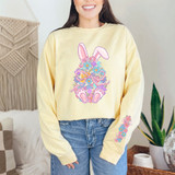 Bunny Floral Easter Egg SET DTF Heat Transfer, colorful Easter bunny design with flowers and details on a woman's yellow sweatshirt.