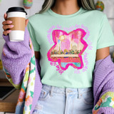 Painted Judas Ate Too DTF Heat Transfer, colorful graphic design of a heart with a scene of people at a table inside, surrounded by pink text.