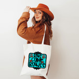 Blue Collar Boujee DTF Heat Transfer, woman holding a white tote bag with the product's colorful design.