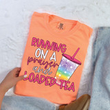 Running On A Prayer And Loaded Tea DTF Heat Transfer, colorful t-shirt with a rainbow unicorn design and text.