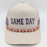Custom Colors Basketball Hat Chain, beige baseball cap with 'GAME DAY' embroidered in purple, featuring a colorful basketball-themed beaded chain decoration around the brim.