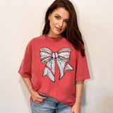 Faux Glitter Baseball Bow DTF Heat Transfer, a silver and red glitter bow design on a red t-shirt.
