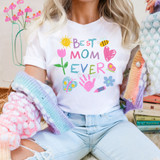 Best Mom Ever Doodle DTF Heat Transfer, colorful printed design on a white T-shirt with flowers, sun, heart, bee, butterfly, handprint, flower, lipstick, and crayon graphics.