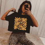 Sunny Days Ahead DTF Heat Transfer, black T-shirt with orange floral design and text.