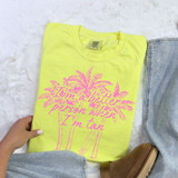 I'm A Better Person When I'm Tan Palm Trees DTF Heat Transfer, a yellow t-shirt with a pink palm tree and script design that reads 'I'm a better person when I'm tan'.
