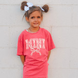 Mini Lace Coquette DTF Heat Transfer, small decorative lace accessory for clothing, shown on a young girl wearing a pink T-shirt with 'MINI' design.